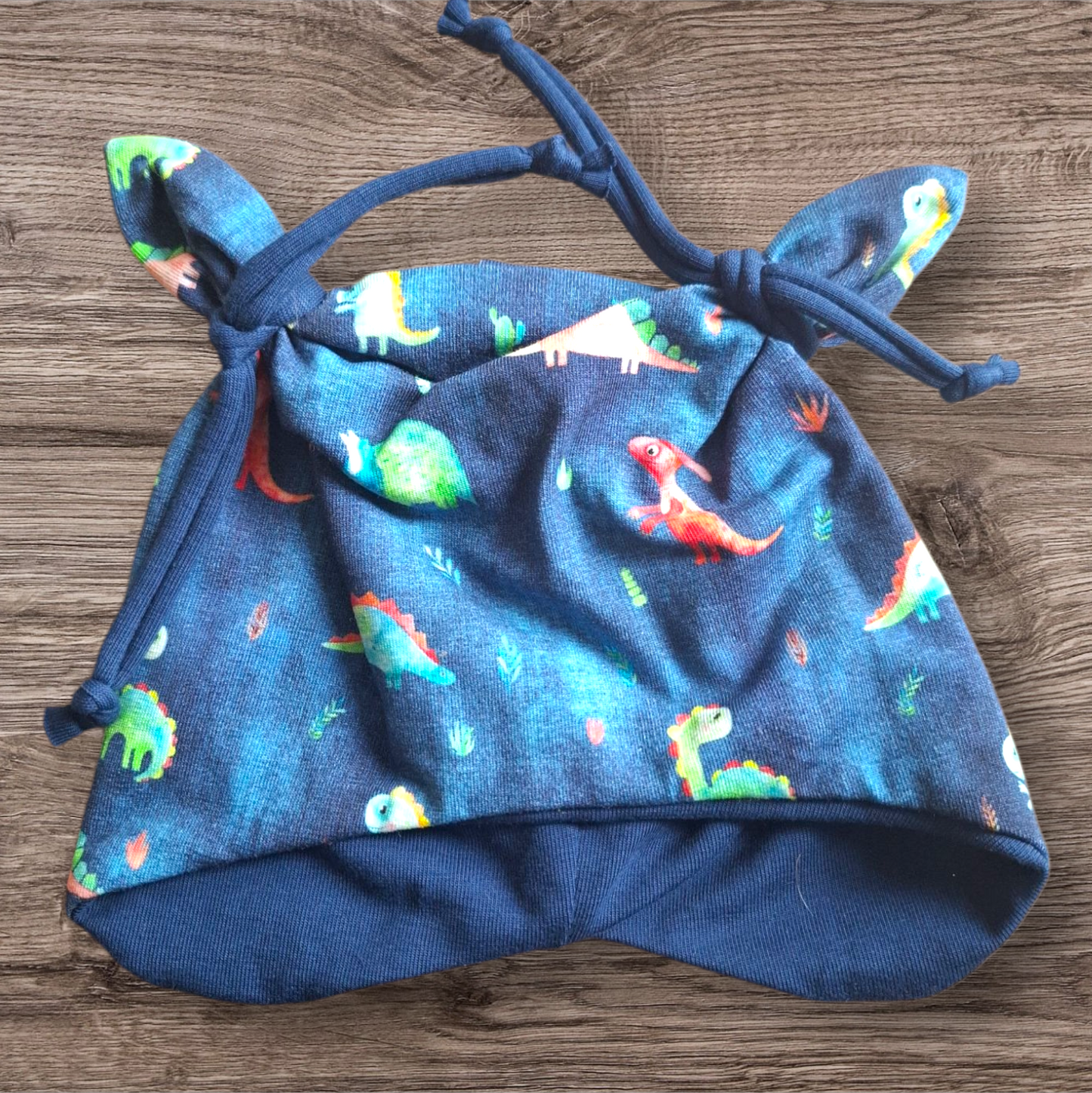 Öhrchenmütze blau Dinos